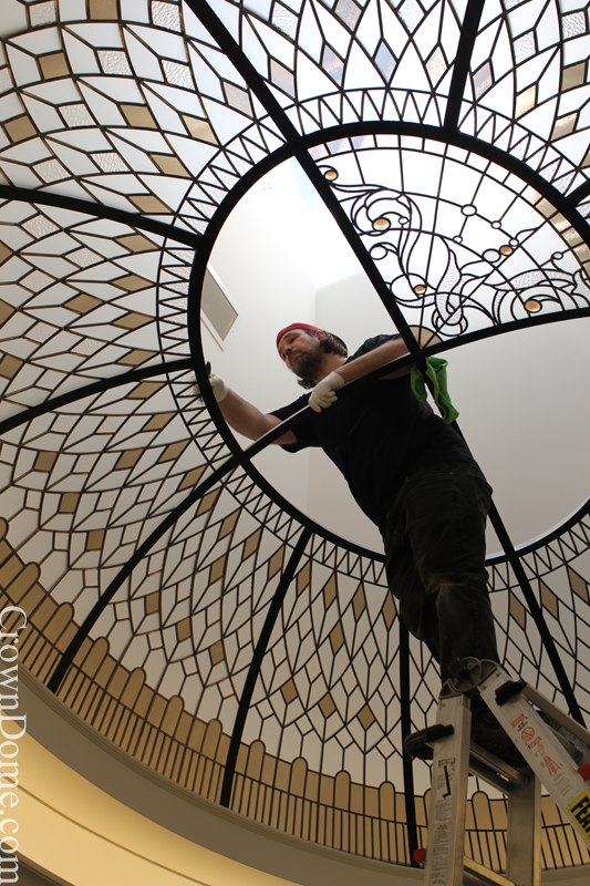 oval stained and leaded glass dome with jewels and beveled glass installation in progress
