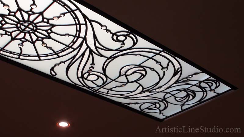 Leaded glass skylight ceiling with clear acid, granit glass and pale colored noggets as accents 