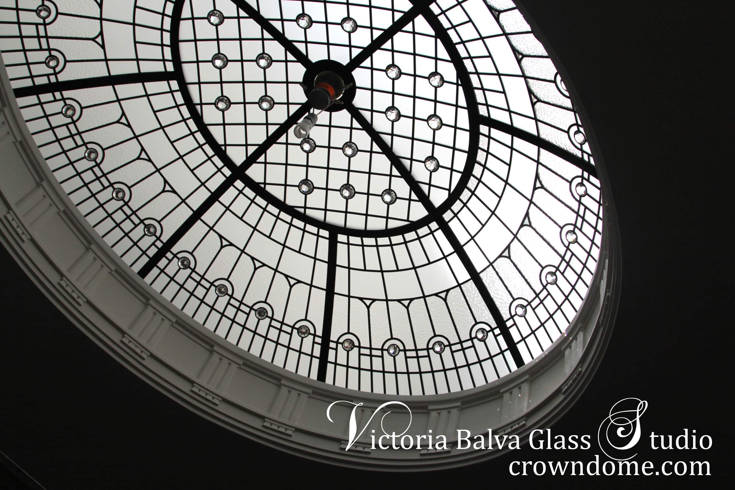 Simple elegant oval leaded glass dome with crystal chandelier hanging from a glass ceiling. Oval leaded glass dome is designed with clear textured glasses, crystal accent jewels in simple and elegant style. Original oval leaded glass dome design by architectural glass artist Victoria Balva