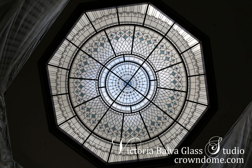 Stained glass dome design with blue custom beveled glass and turquoise crystal jewels. Grand double height entrance foyer for a luxury residence in Toronto