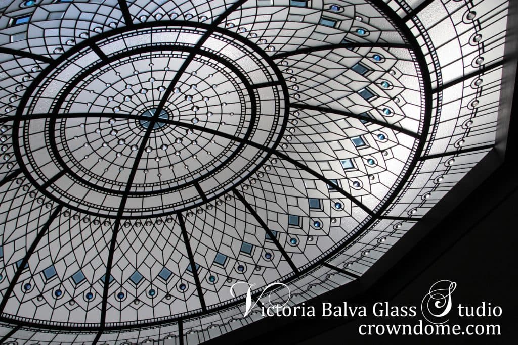Stained glass dome skylight with hand beveled glass and bright blue, clear and bright turquoise crystal jewels for grand foyer entrance of a custom built residence in Toronto