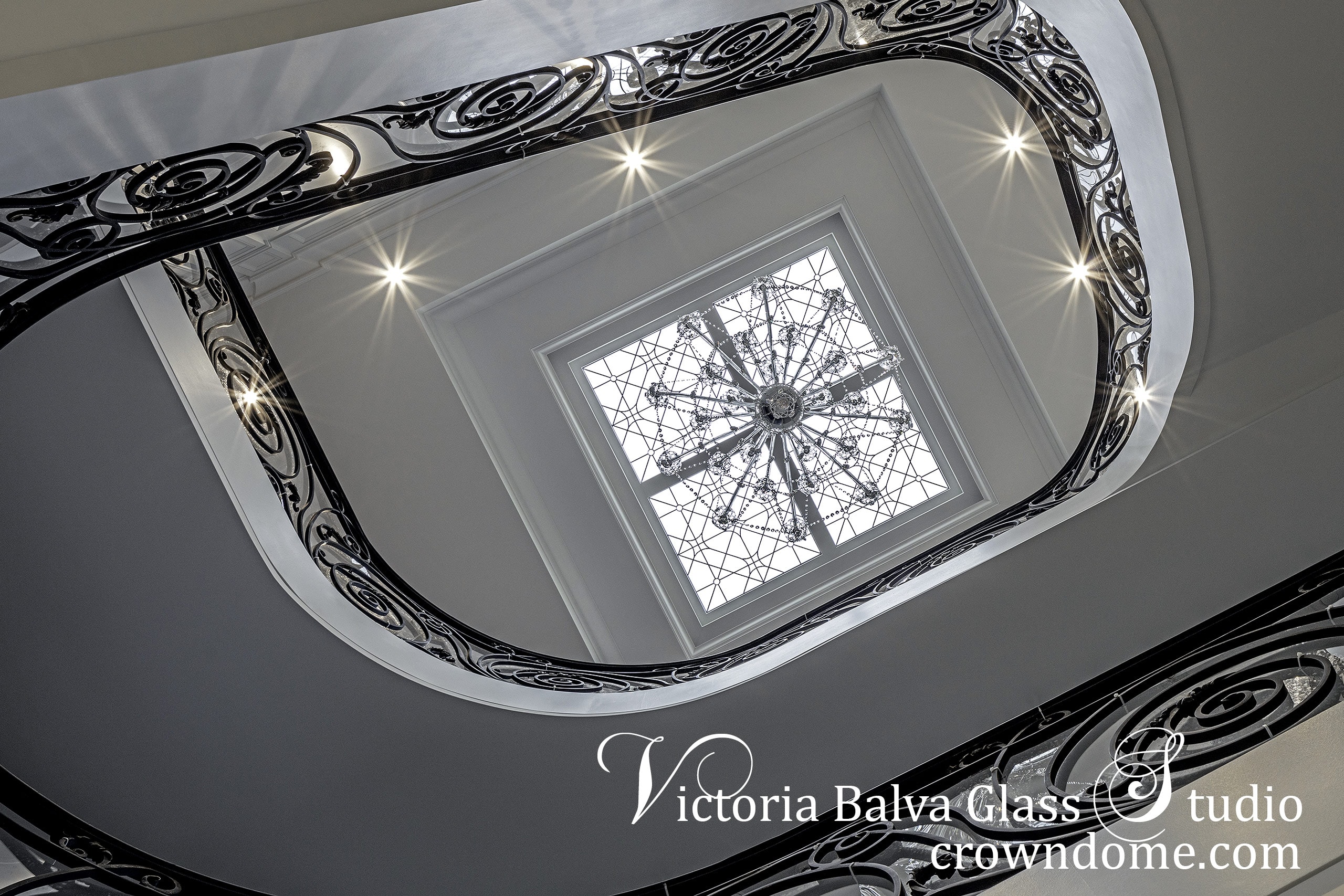leaded glass skylight for a spiral staircase with crystal chandelier