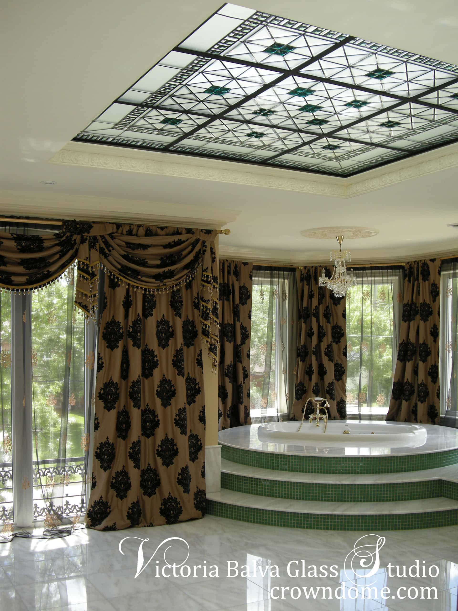 Gorgeous bathroom stained beveled leaded glass skylight ceiling with emerald accent jewels and colored beveled glass for a bathroom of a custom built residence. Simple geometric stained leaded glass design with custom beveled glass and large emerald jewels by glass artist Victoria Balva