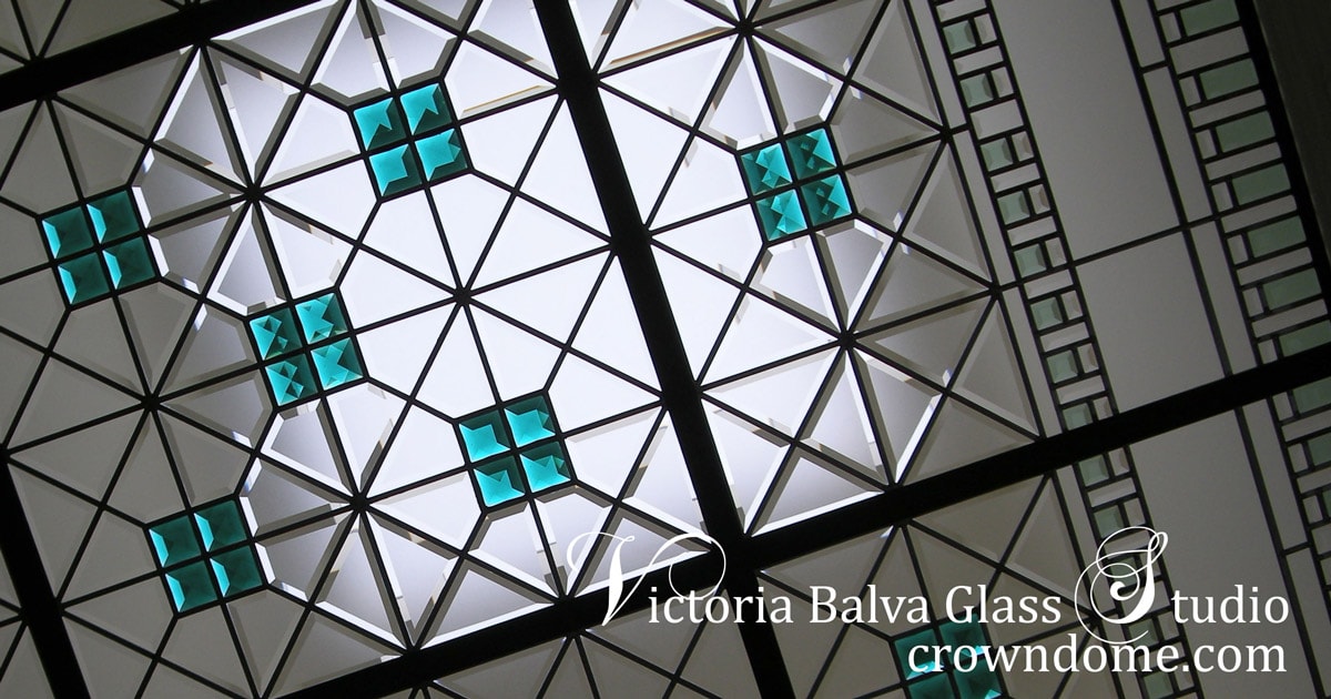 Contemporary geometric stained leaded glass skylight with custom beveled glass and large emerald jewels by stained glass artist Victoria Balva. Contemporary stained beveled leaded glass ceiling with emerald accent jewels and colored beveled glass for a custom built residence.