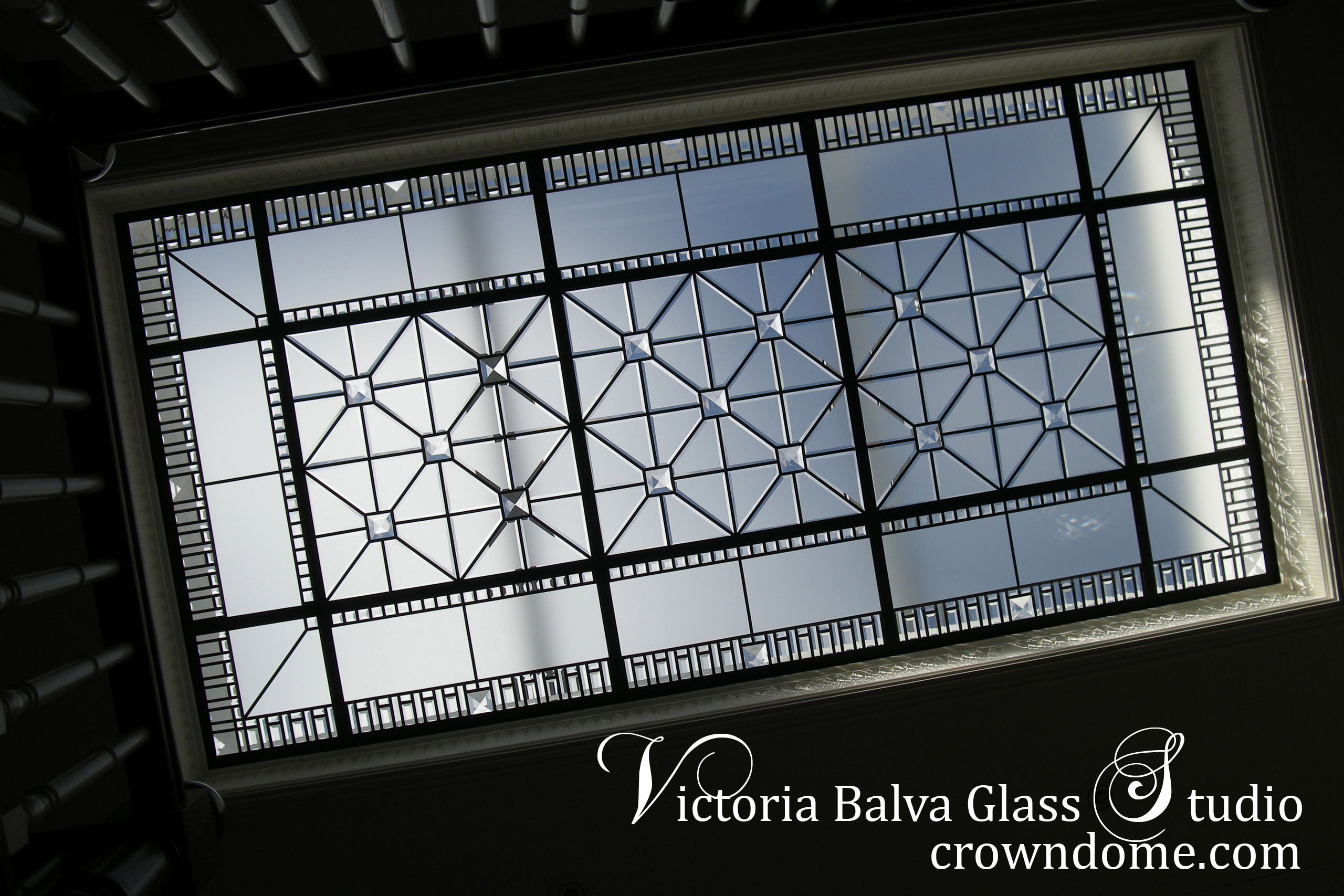 Breathtaking beveled leaded stained glass skylight ceiling with custom beveling and large clear crystal jewels in simple geometric style for a hallway of luxury custom built residence in Toronto. Original beveled leaded glass skylight design by architectural glass artist Victoria Balva