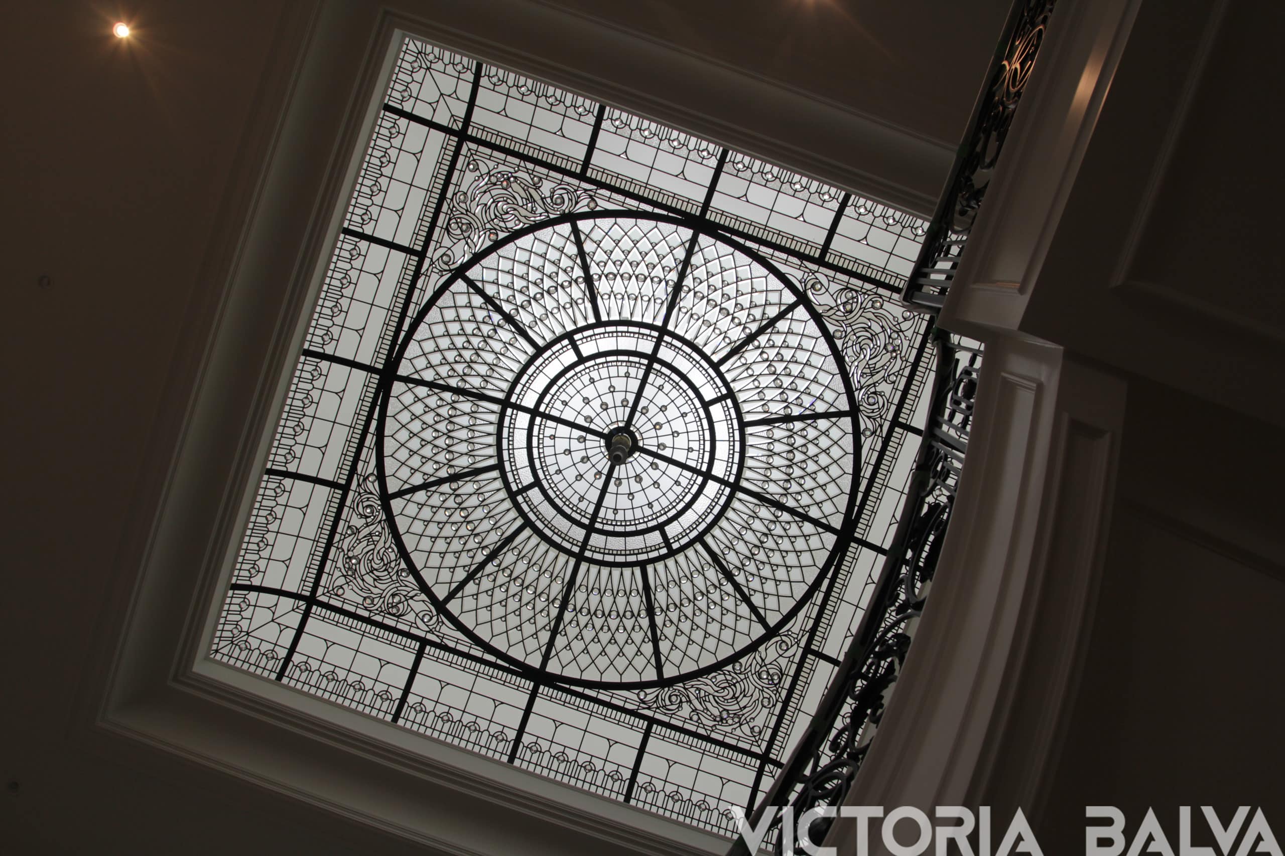 Stained glass dome ceiling with custom bevelled glass for a classic fyer of a custom built residence