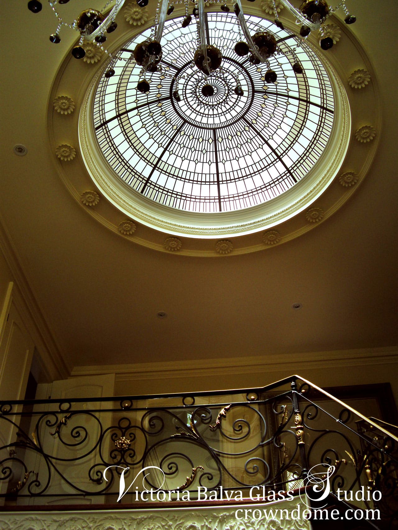 double height entrance foyer stained glass dome ceiling in geometrical style