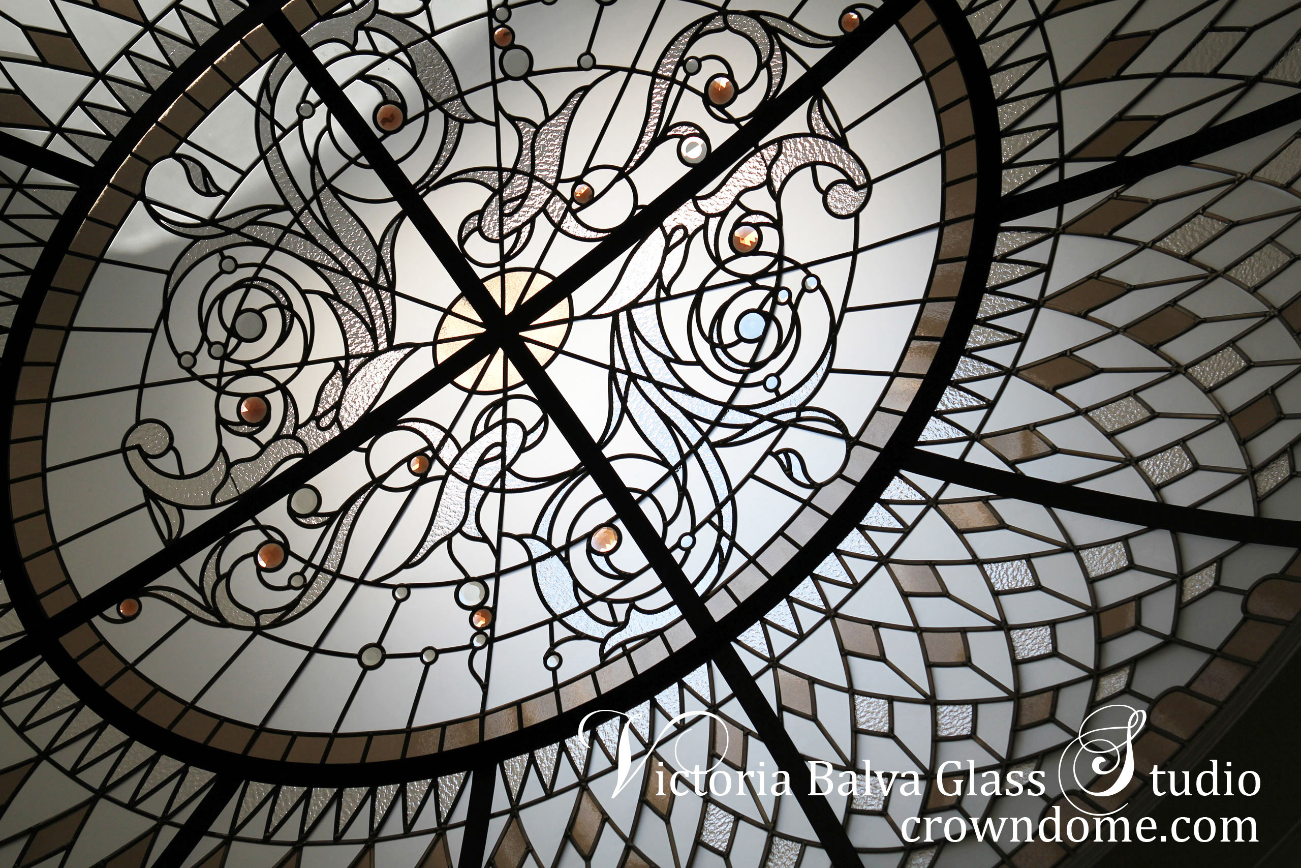 Large oval stained leaded glass dome detail with acanthus center and rosette glass dome ornament for an oval hallway of a custom built house in Toronto