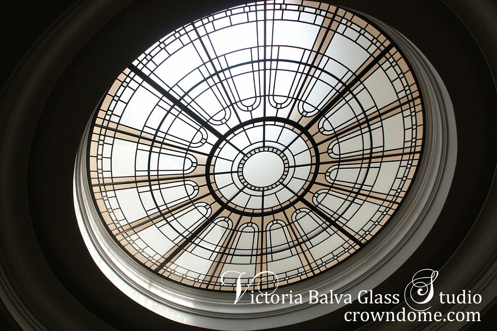 Circular glass skylight ceiling Montresor with clear and tinted textured glass for a luxury custom built residence in Toronto. Simple geometric design of stained leaded glass skylight by glass artist Victoria Balva