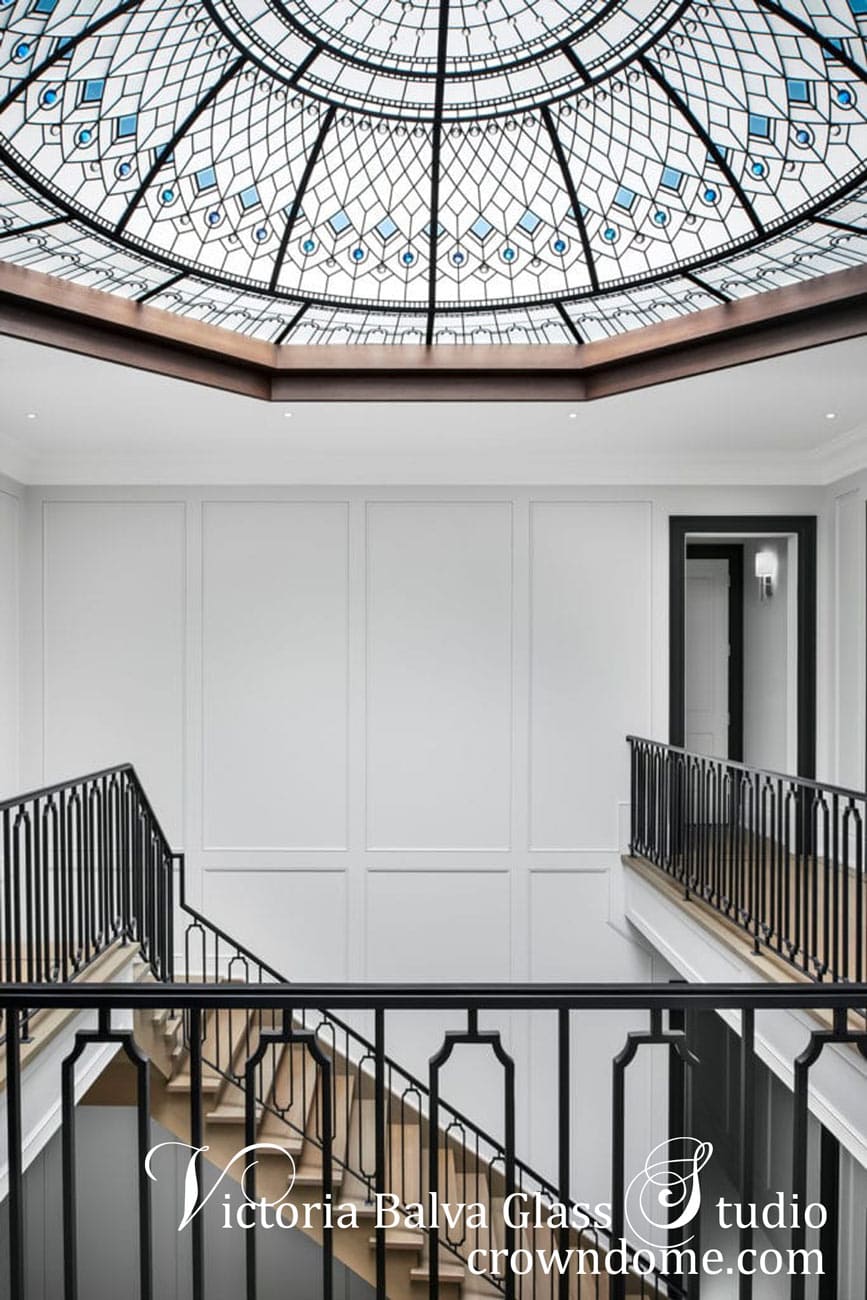 Large octagon stained glass dome doe a double height foyer fills space with light
