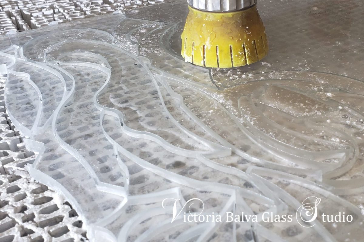Water jet cutting of 8mm crystal clear glass complex geometrical forms